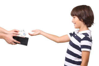 Photo of Mom giving her son pocket money on white background, closeup