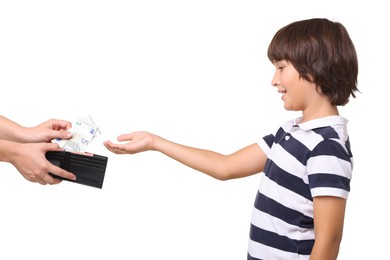 Photo of Mom giving her son pocket money on white background, closeup