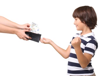 Photo of Mom giving her son pocket money on white background, closeup