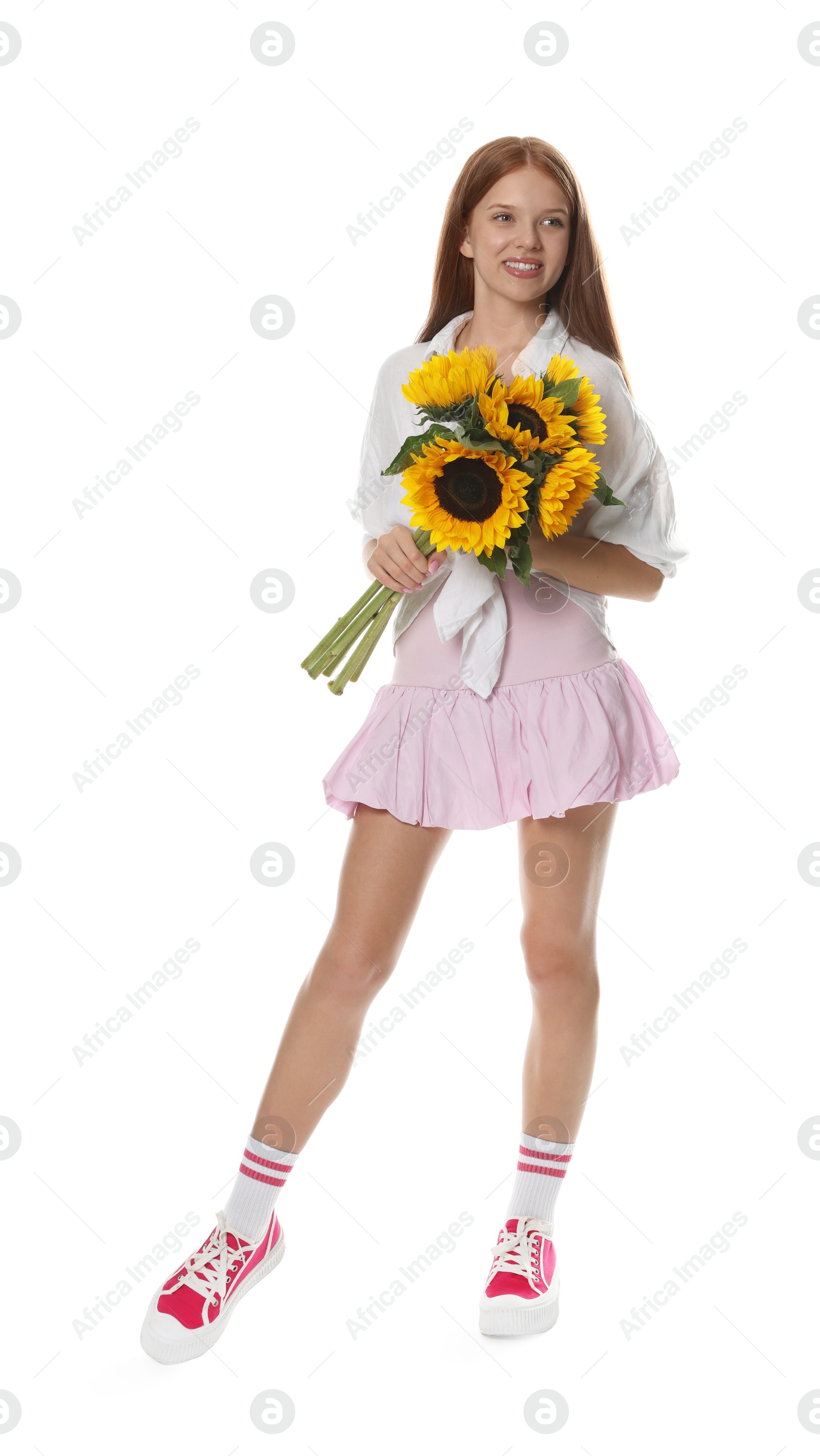 Photo of Teenage girl with bouquet of beautiful sunflowers on white background