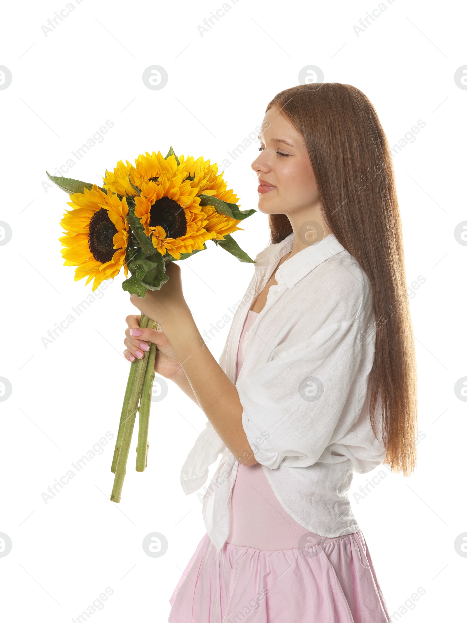 Photo of Teenage girl with bouquet of beautiful sunflowers on white background