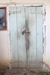 Photo of Old closed shed in yard, closeup view