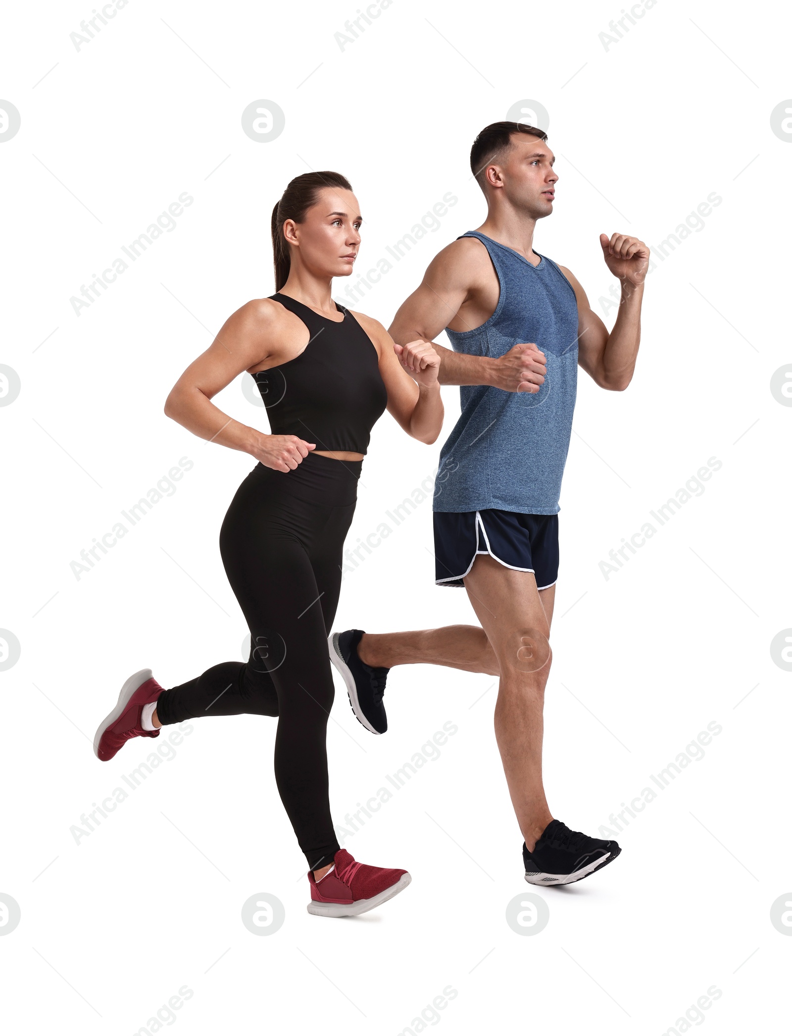 Sporty man and woman running on white background Image of Sporty man and woman running on white background