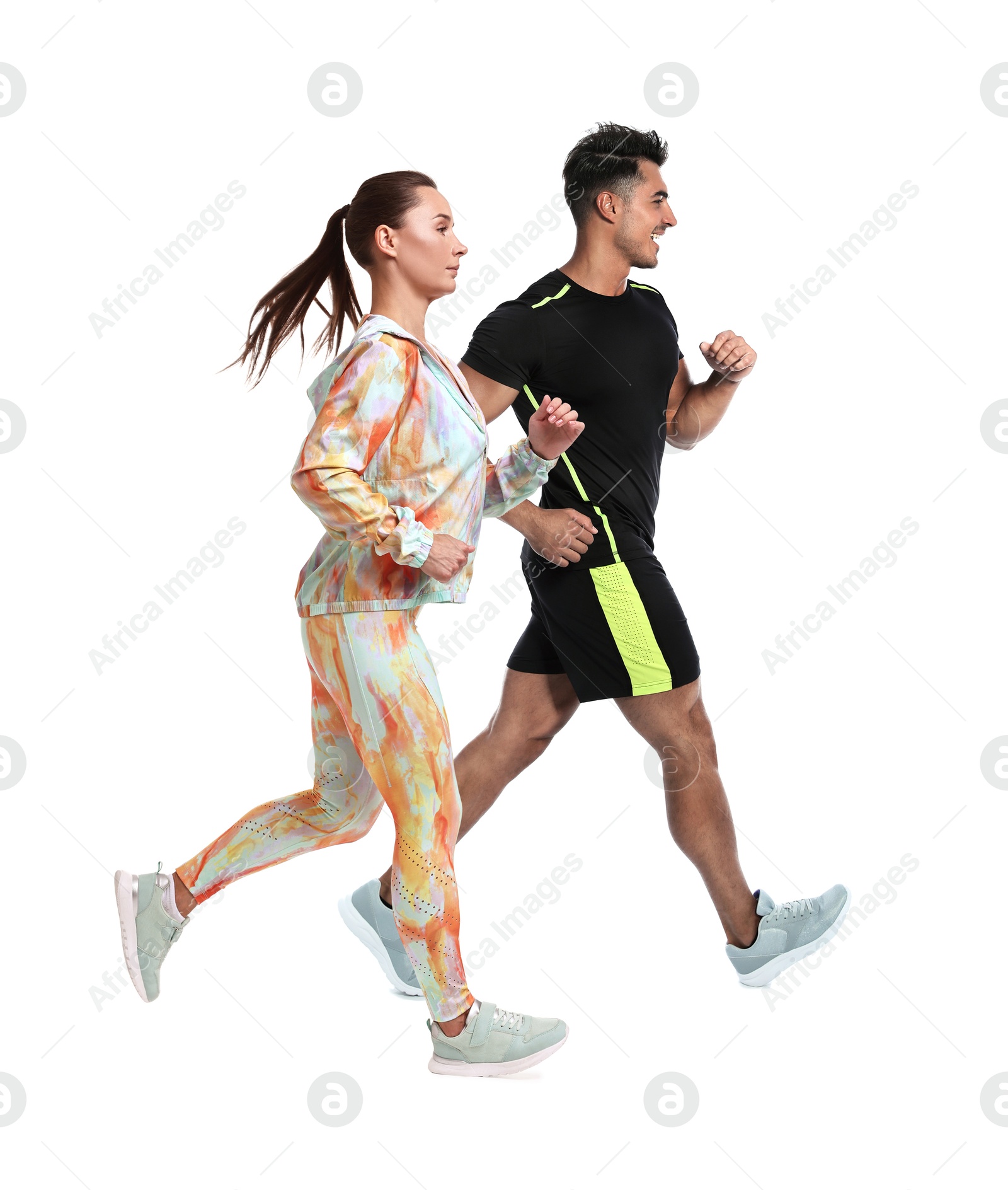 Image of Sporty man and woman running on white background