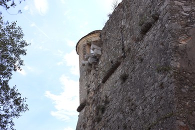 Photo of Picturesque view of beautiful old building against blue sky, low angle view