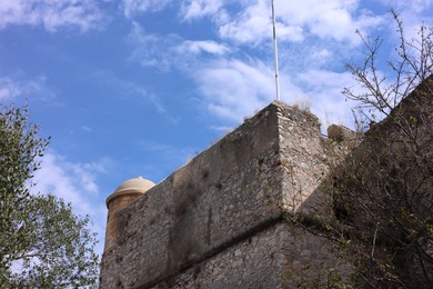 Photo of Picturesque view of beautiful old building against blue sky, low angle view