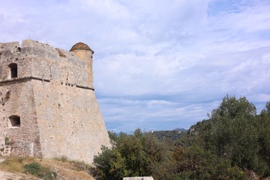 Photo of Picturesque view of beautiful old building against blue sky, low angle view