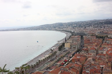 Photo of Picturesque view of cityscape with buildings and sea