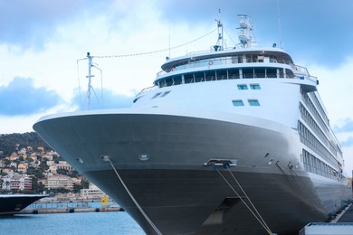 Photo of View of ferry moored in sea port at summer
