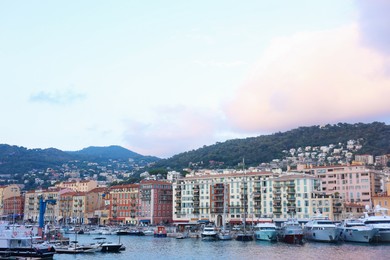 Photo of Beautiful view of city, many boats and sea at summer