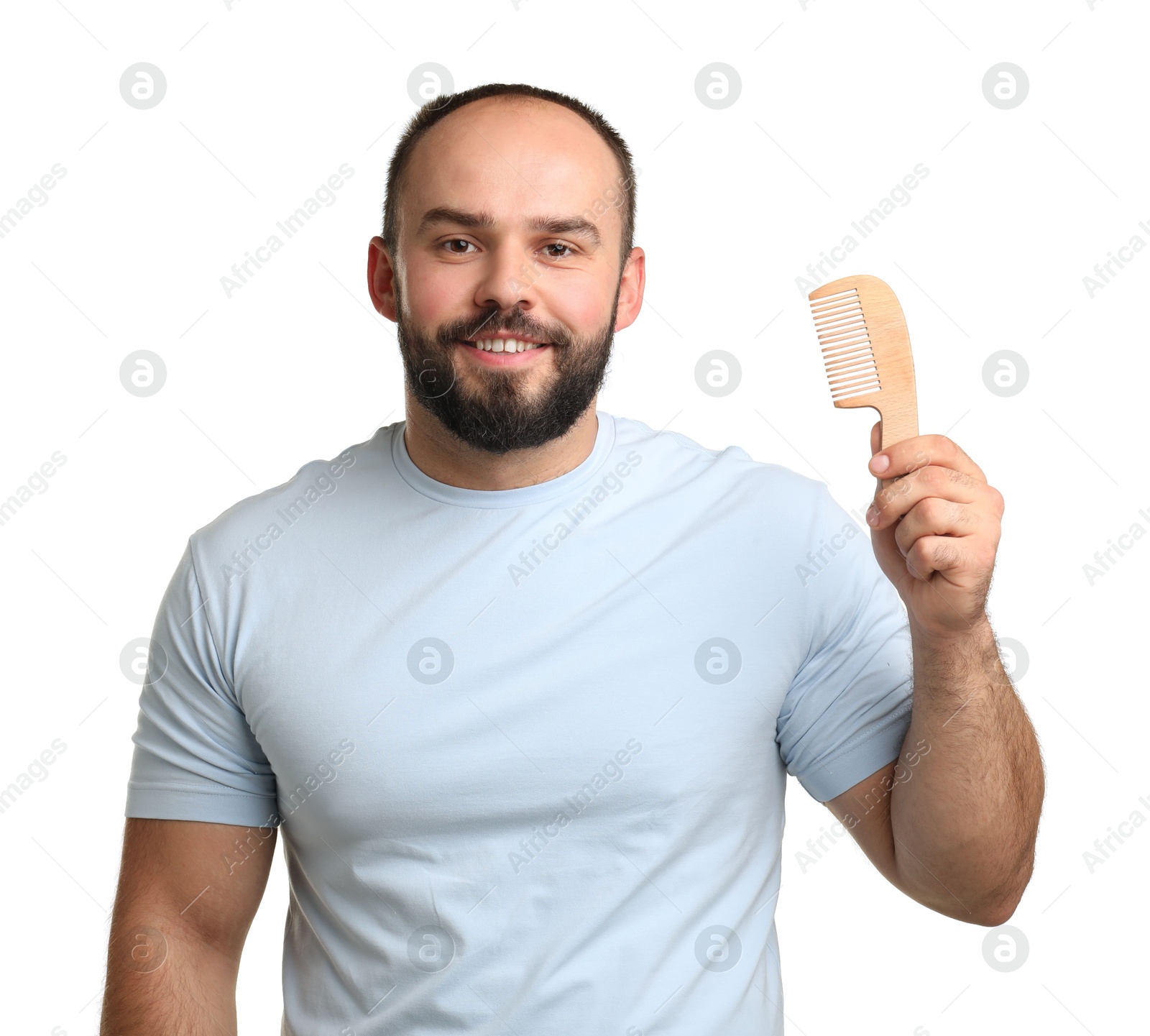 Photo of Baldness problem. Smiling man with comb on white background
