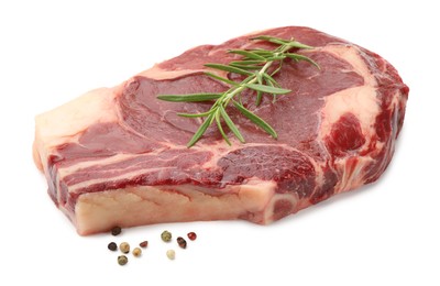 Photo of Piece of raw beef meat and spices isolated on white