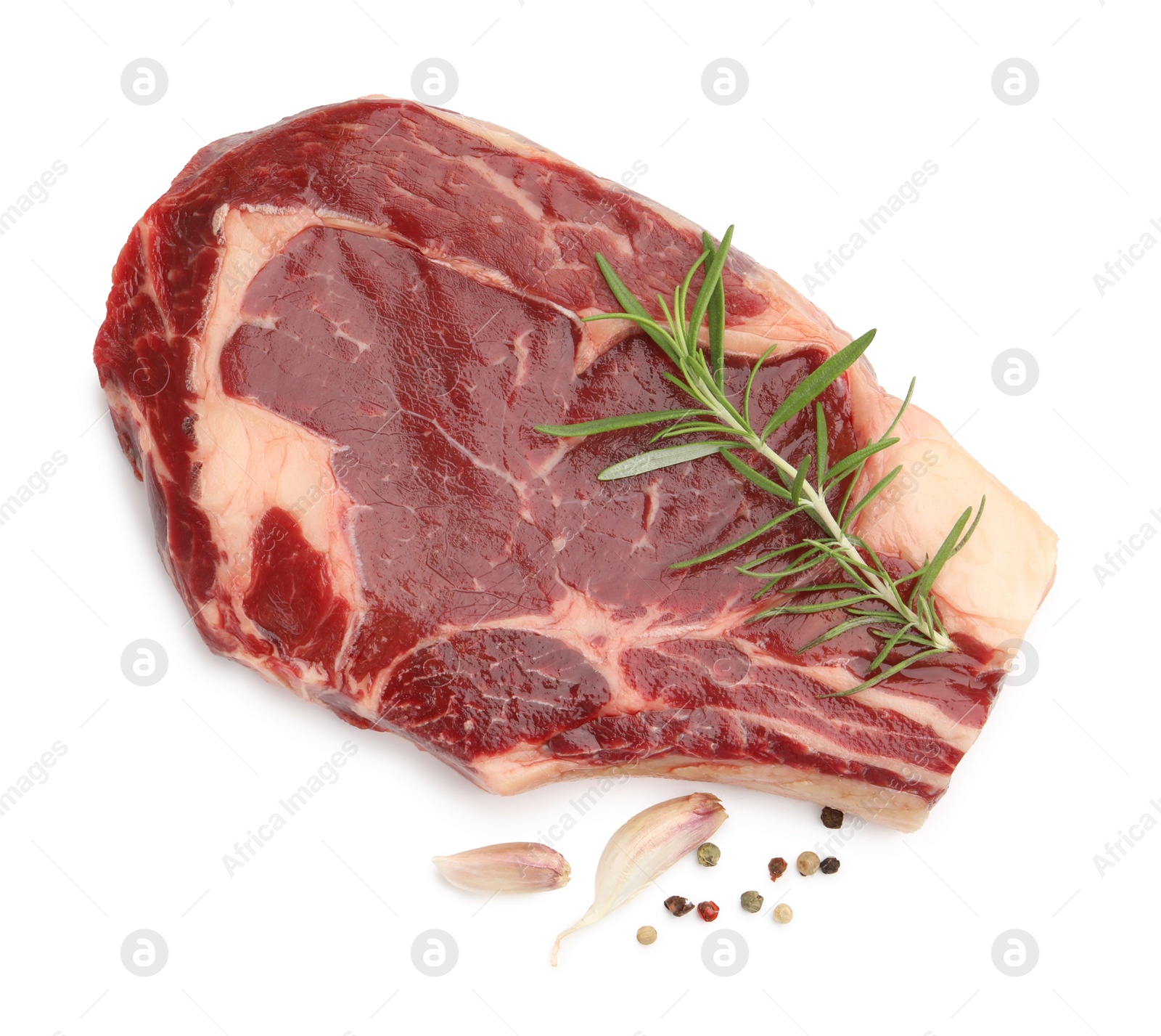 Photo of Piece of raw beef meat and spices isolated on white, top view