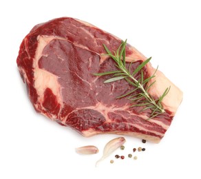 Photo of Piece of raw beef meat and spices isolated on white, top view