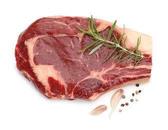 Photo of Piece of raw beef meat and spices isolated on white, top view