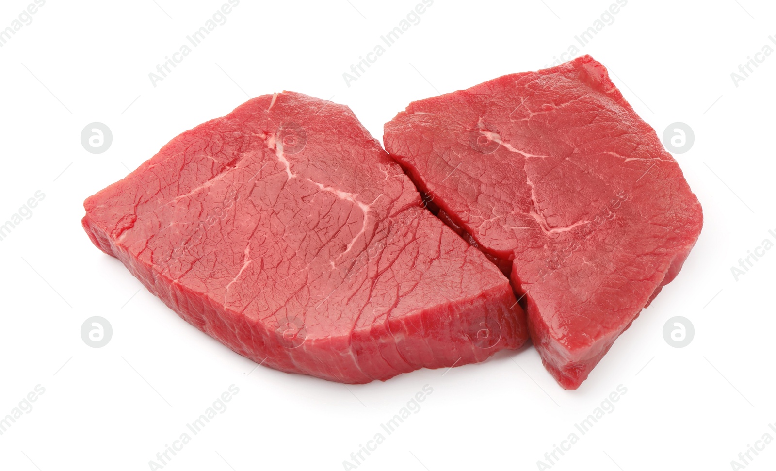 Photo of Pieces of raw beef meat isolated on white