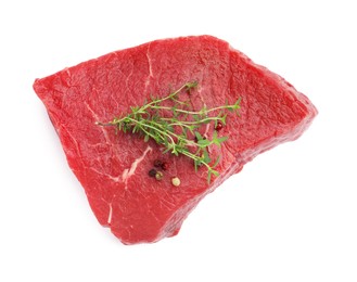 Photo of Piece of raw beef meat and spices isolated on white, top view