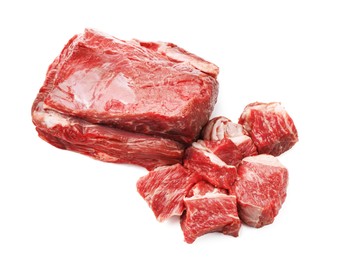 Photo of Pieces of raw beef meat isolated on white