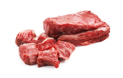 Photo of Pieces of raw beef meat isolated on white
