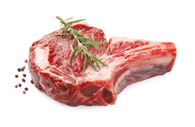 Photo of Piece of raw beef meat and spices isolated on white