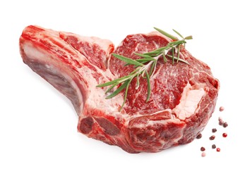 Photo of Piece of raw beef meat and spices isolated on white