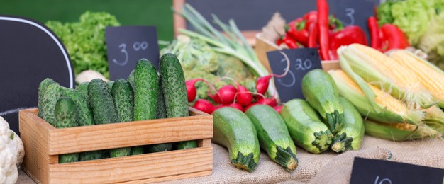 Photo of Many different vegetables on stall at farmer's market, closeup