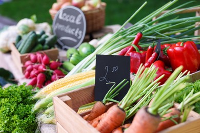 Photo of Many different vegetables on stall at farmer's market, closeup
