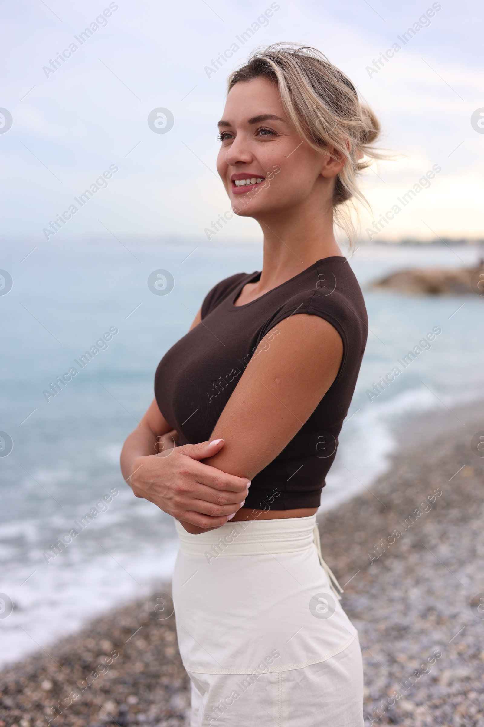 Photo of Beautiful young woman near sea on beach