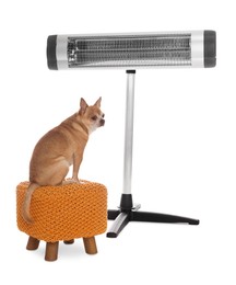 Photo of Cute little dog on pouf near electric heater against white background