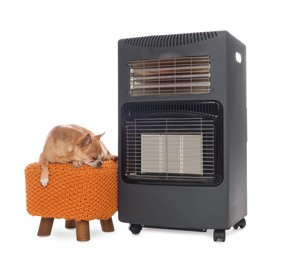 Photo of Cute little dog on pouf near electric heater against white background