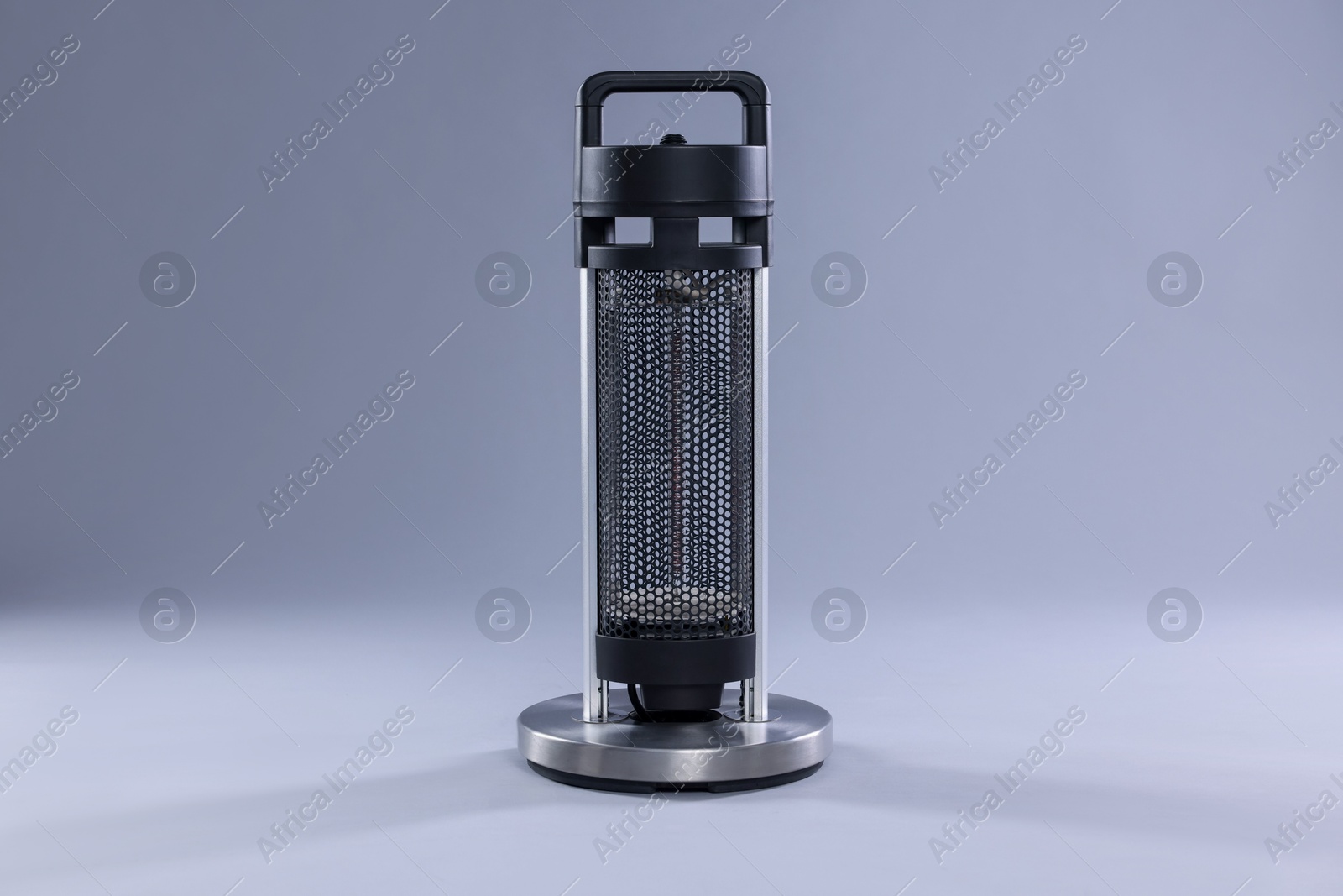 Photo of Modern electric heater on light grey background