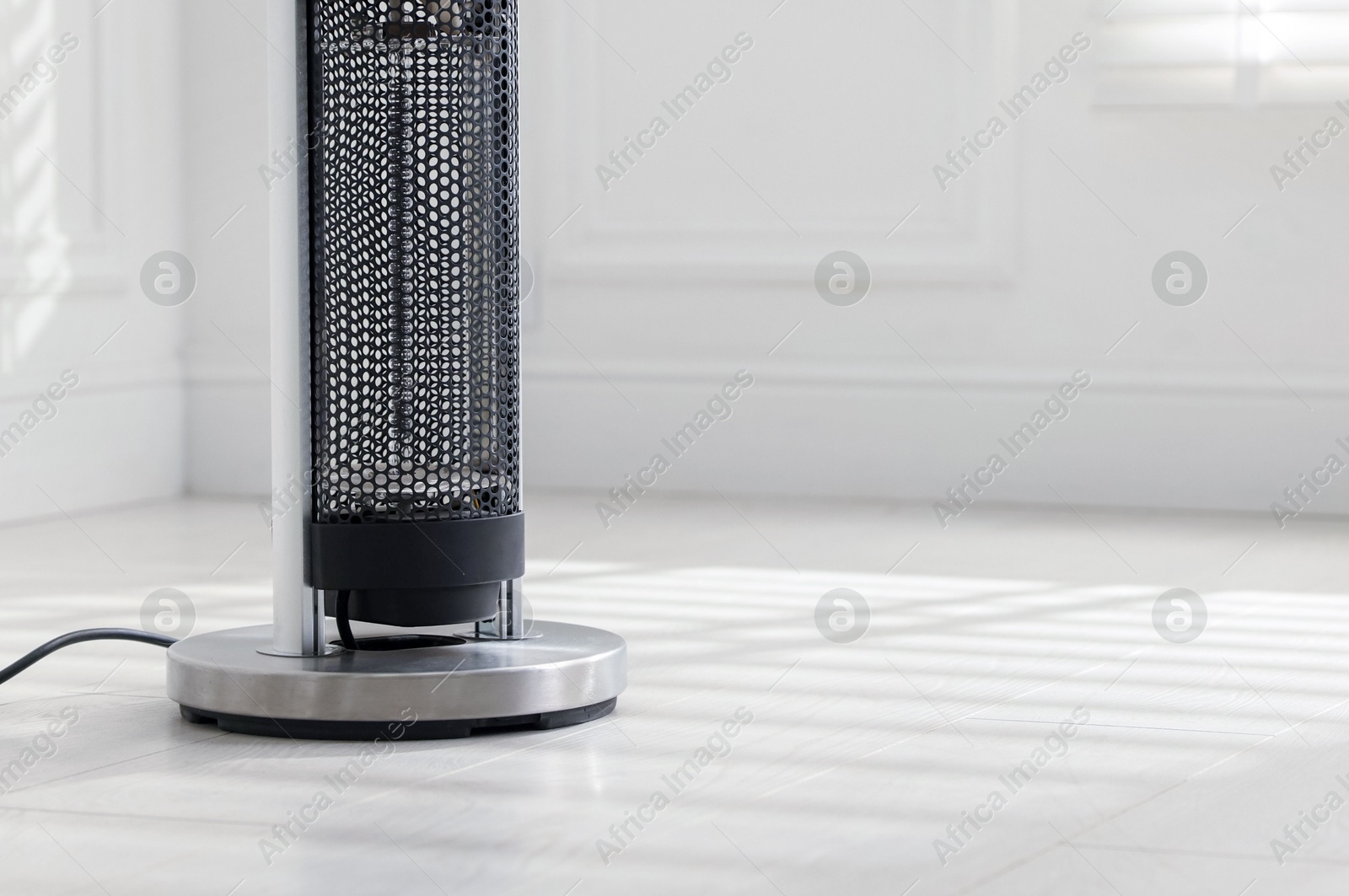 Photo of Modern electric heater at home, closeup. Space for text