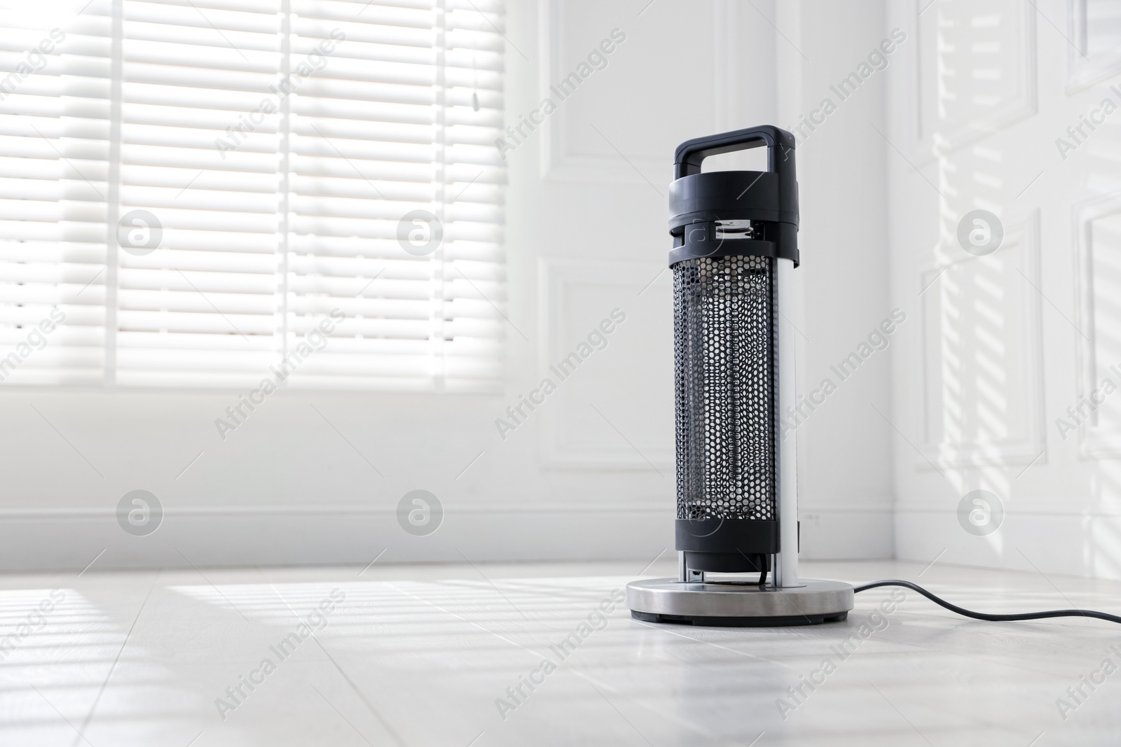 Photo of Modern electric heater at home, space for text