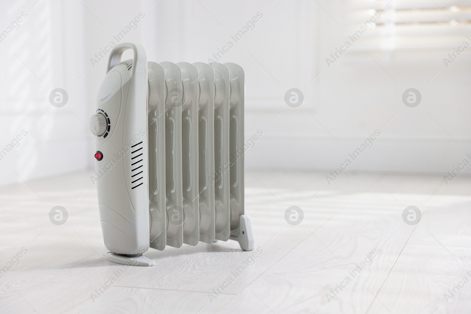 Photo of Modern electric heater at home, space for text