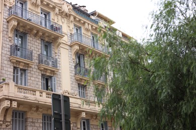 Photo of Nice, France - September 1, 2025: Beautiful building and tree in city