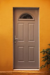 Photo of Entrance of residential house with beige door