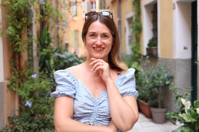 Photo of Portrait of beautiful woman on city street