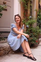 Photo of Portrait of beautiful woman on city street