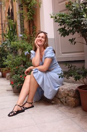 Photo of Portrait of beautiful woman on city street