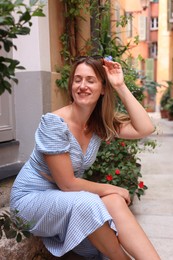 Photo of Portrait of beautiful woman on city street