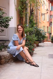 Photo of Portrait of beautiful woman on city street