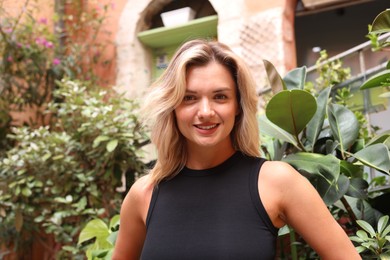 Photo of Portrait of beautiful woman on city street