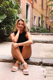 Photo of Portrait of beautiful woman on city street