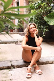 Photo of Portrait of beautiful woman on city street