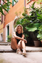 Photo of Portrait of beautiful woman on city street
