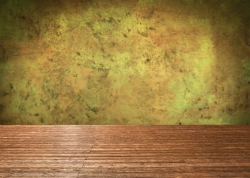 Image of Empty wooden floor and color textured wall. Space for design