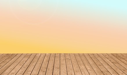 Image of Empty wooden floor and color gradient wall. Space for design