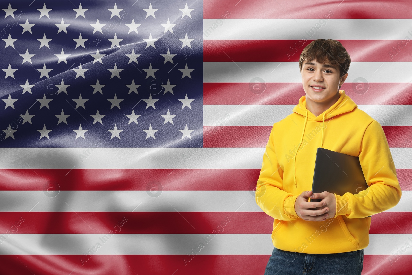 Image of Student with laptop against flag of USA. Language school