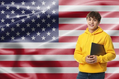 Image of Student with laptop against flag of USA. Language school
