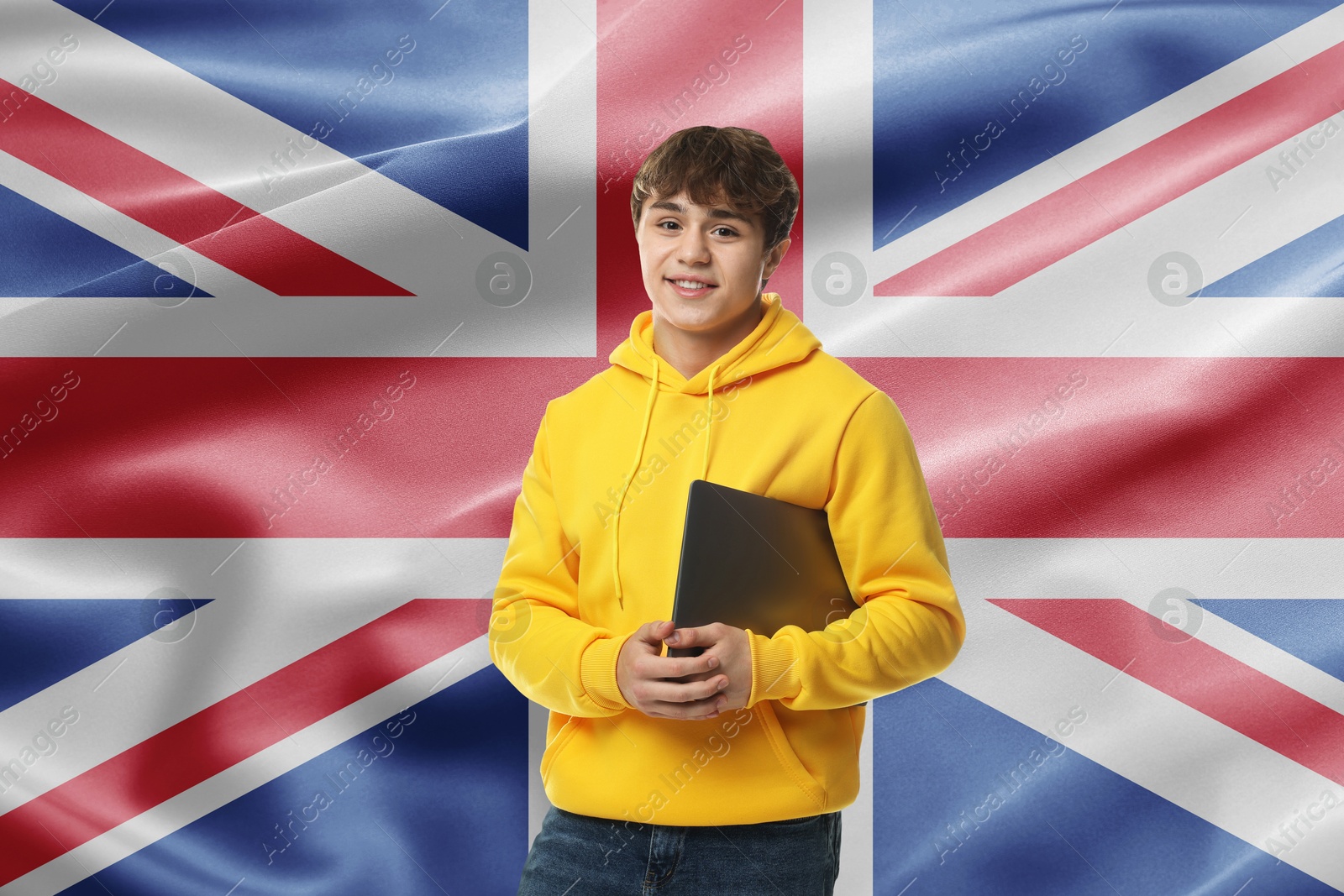 Image of Student with laptop against flag of United Kingdom. Language school